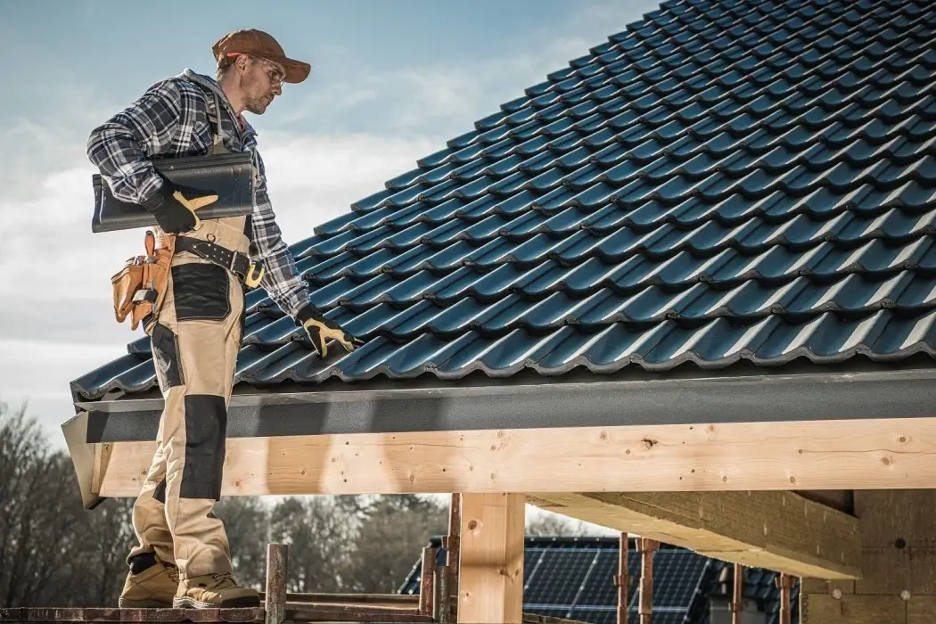 seo for roofing companies: roofer working on roof.